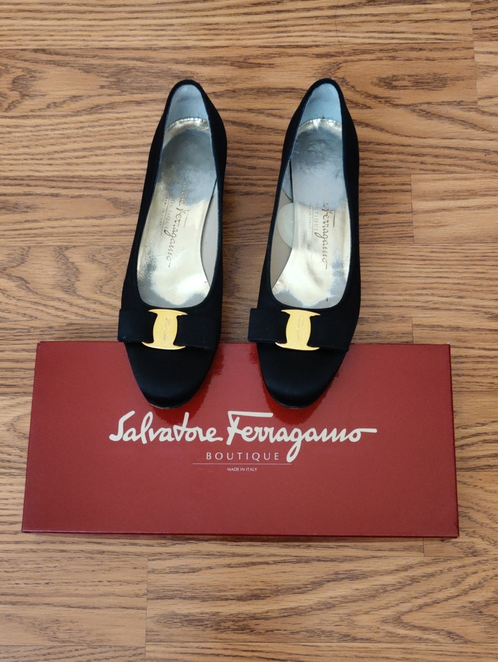 Salvatore Ferragamo Black Bow Pumps with Gold Logo Accent